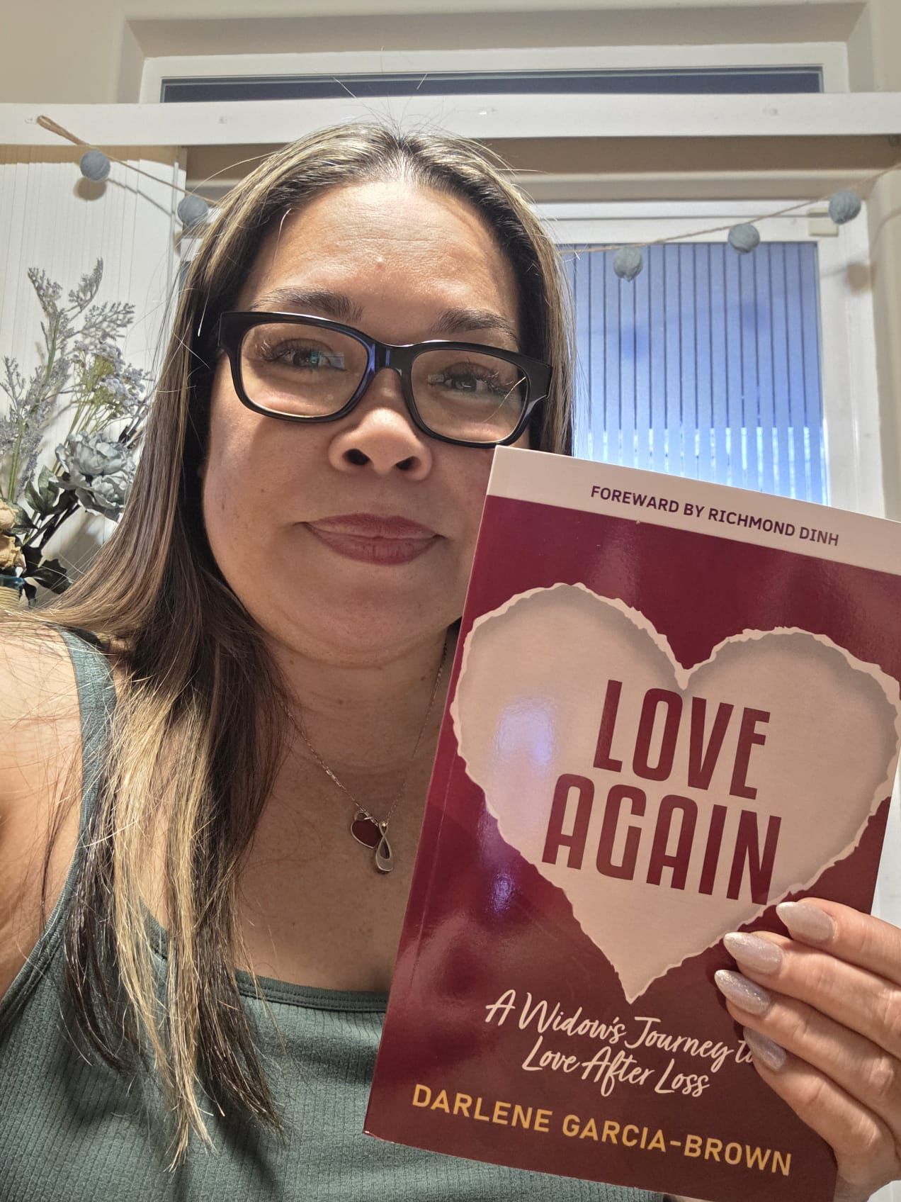 Widow holding Love Again book